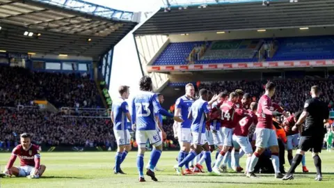 Reuters Aston Villa midfielder Jack Grealish sits on the ground following the attack