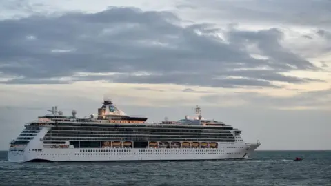 Getty Images Serenade of the Sea, a huge cruise ship, pictured on the sea.