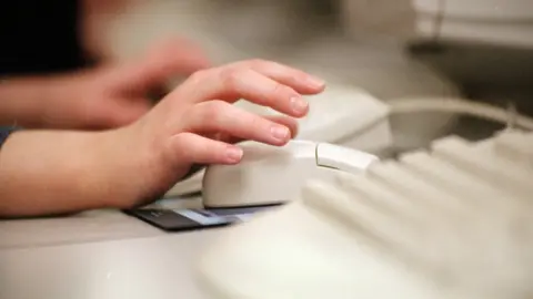 BBC Person typing on computer