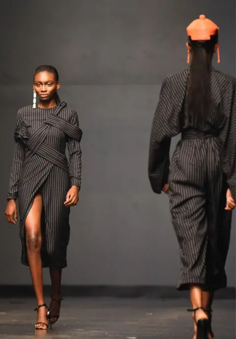 AFP Designs by Fruche are modeled on the catwalk during Lagos Fashion Week.