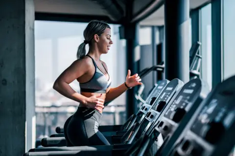 Getty Images Woman on treadmill