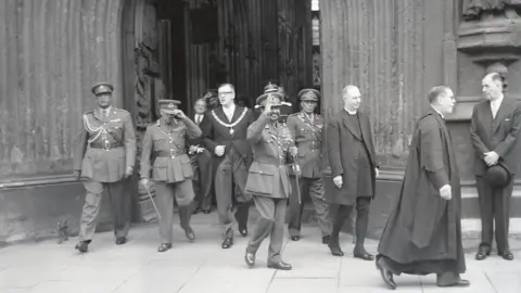 Bath In Time Haile Selassie leaving Bath Abbey to meet crowds, October 1954