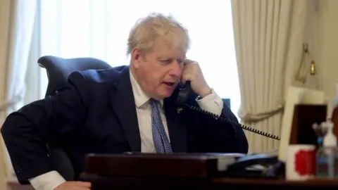 Reuters Boris Johnson speaking to Volodymyr Zelensky on the phone