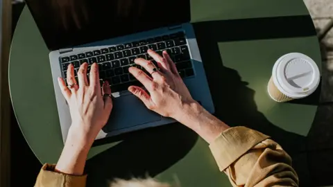 Getty Images A person types on a laptop