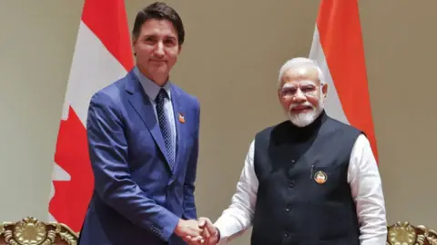 Getty Images India's Prime Minister Narendra Modi (R) and his Canada counterpart Justin Trudeau shake hands in New Delhi on 10 September 2023