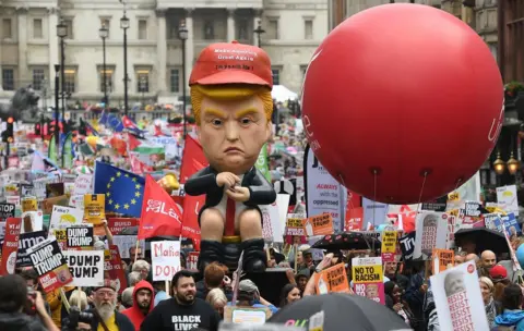 EPA A model of Mr Trump sat on a golden toilet