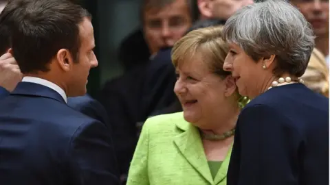 AFP Emmanuel Macron, Theresa May and Angela Merkel at the summit