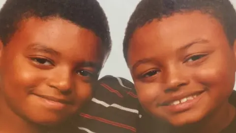 Family handout Tavis Spencer-Aitkens, on right with twin Tyler