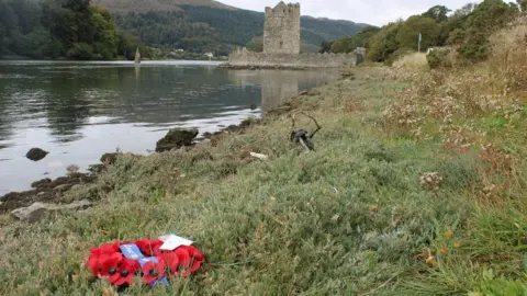 Richard McKee Damaged wreaths at the Narrow Water memorial