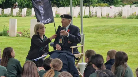 BBC/Naj Modak D-Day veteran speaking to school children