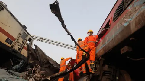 EPA Rescuers searching the wreckage for survivors