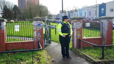 Ben Birchall/PA Wire A police officer outside a cordon at Rawnsley Park