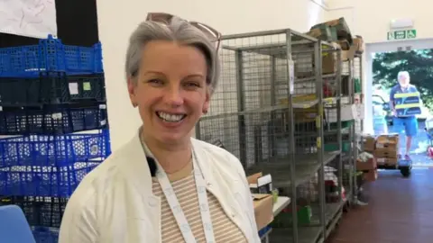 woman with short grey hair smiling