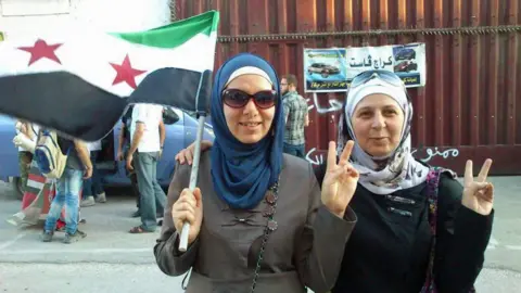 Salim Mudar Om on the right at a rally in East Aleppo