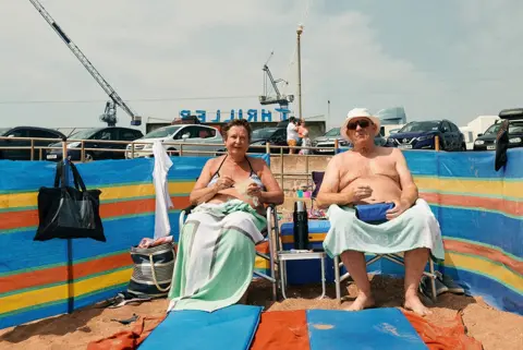 David Hares  A couple eating lunch on Paignton Sands