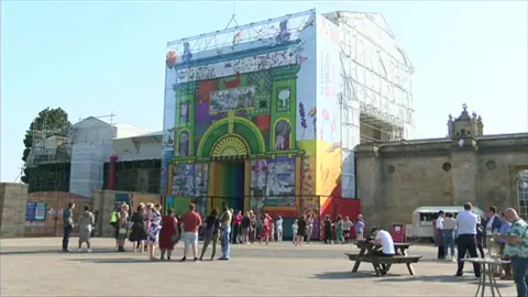 BBC People admiring the mural at the Flagstaff Gate