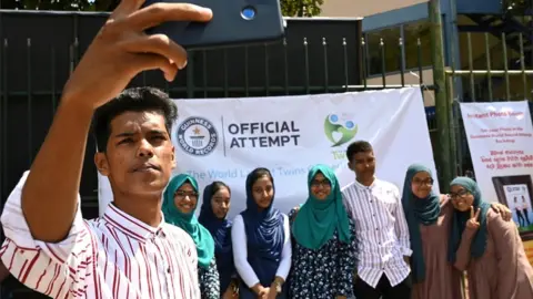 AFP Sri Lankan twins pose for a group picture at the Sri Lanka twins event in Colombo on 20 January 2020