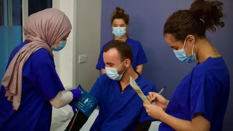 Martin Giles/BBC Refugee nurses