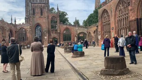 People gathered at Coventry Cathedral to hear church bells toll