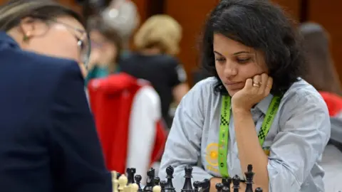 Getty Images India's Bhakti Kulkarni competes during her Round 10 game against the Kazakhstan's team at the 44th Chess Olympiad 2022, in Mahabalipuram on August 8, 2022.
