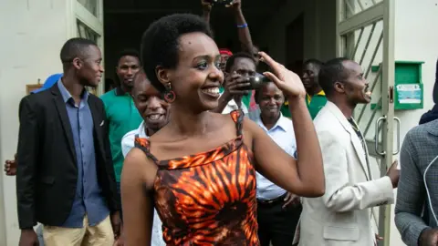 AFP/Getty Diane Rwigara (front L), a critic of Rwanda's President, reacts as she leaves the Kigali's High Court