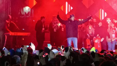 Reuters A man holds a knife after the stabbing in Gdansk