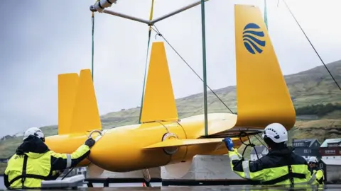 Minesto the kite hanging from hoists on land