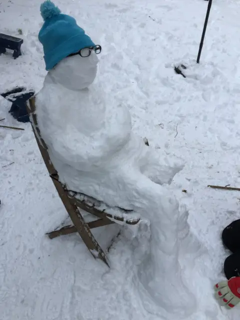 Esme and Ava McComb What is this snowman doing? "Just chillin'," say Esme and Ava McComb in Edinburgh