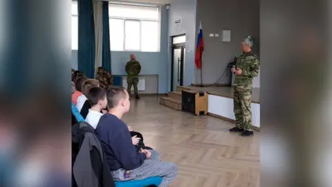 Telegram channel New Melitopol Russian soldiers at a school in occupied Melitopol