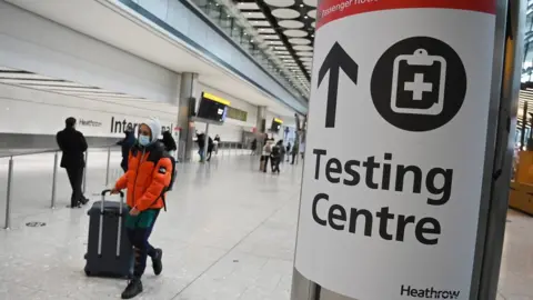 EPA Passenger and sign at Heathrow