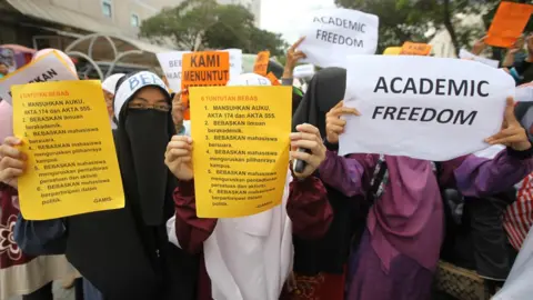 AFP Students display placards reading 'Academic Freedom' during a protest in downtown Kuala Lumpur in 2011