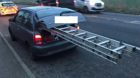 Cambs Police Ladder in car