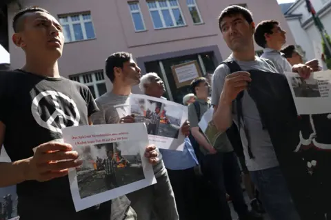 AFP Afghans protest against deportations outside the Afghan embassy in Berlin, 31 May