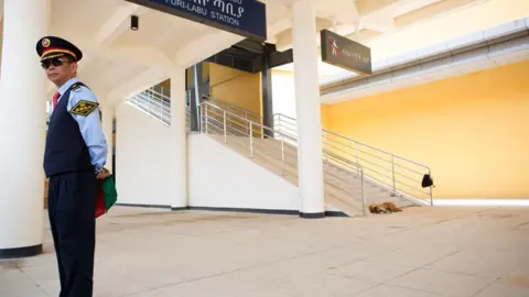 Getty Images A Chinese employee of the Addis Ababa / Djibouti train line stands at the Feri train station on September 24, 2016.