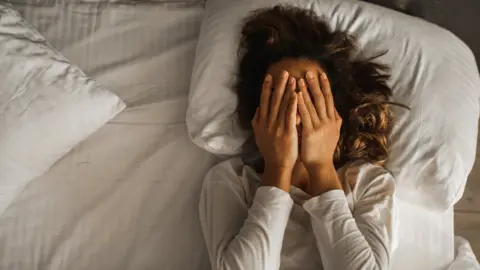 Getty Images Person in bed unable to sleep