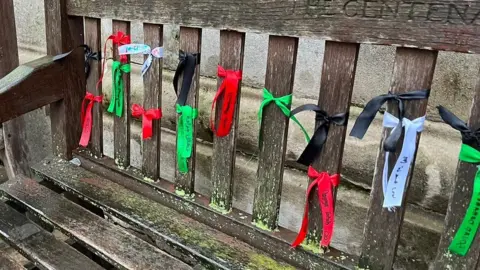 Ribbons tied to a bench at UCL