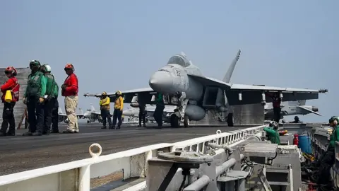 Getty Images An F/A-18E Super Hornet assigned to the Sidewinders of Strike Fighter Squadron (VFA) 86 prepares to launch from the aircraft carrier USS Dwight D. Eisenhower