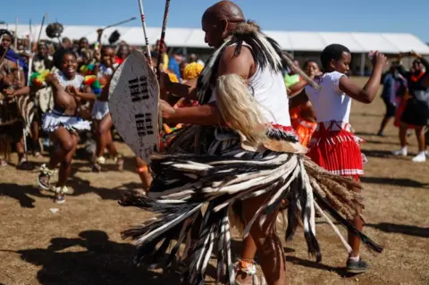 AFP People dancing in traditional clothes
