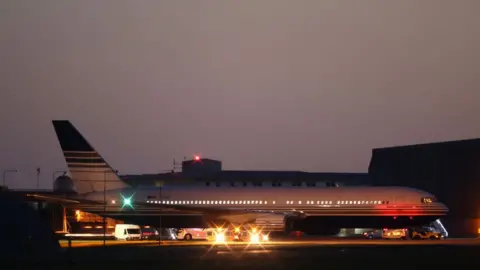 Getty Images The grounded Rwanda deportation flight EC-LZO Boeing 767 at Boscombe Down Air Base, on June 14, 2022 in Boscombe Down. The flight taking asylum seekers from the UK to Rwanda was grounded at the last minute after intervention of the European Court of Human Rights