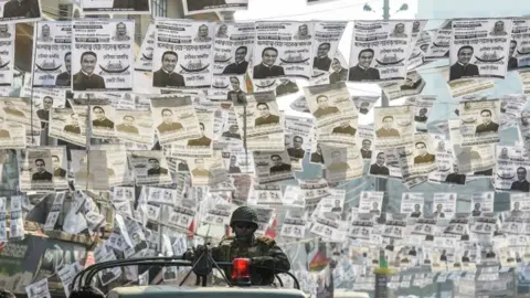 AFP Police patrol Dhaka, Bangladesh, during a general election