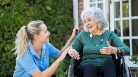 Getty Images older person with carer