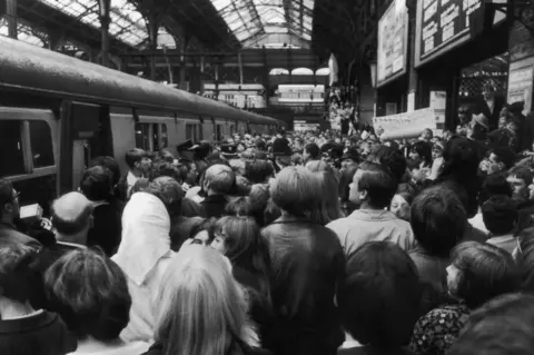 Getty Images Fans of the pirate radio station, Radio London at Liverpool Street Station, London to meet the DJ after they travelled down from Felixstowe. Throughout the day, the station's disc jockeys, including 'Big L', had asked fans to meet them at Liverpool Street after Radio London closed down.