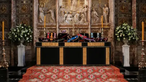 PA Media Insignia belonging to Britain's Prince Philip are placed on the altar in St George's Chapel, Windsor, ahead of his funeral, Britain