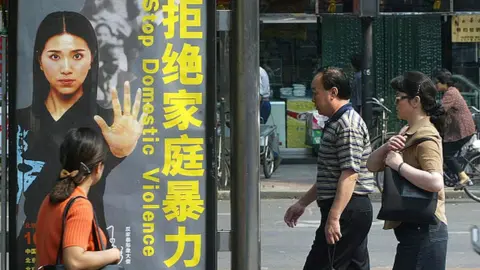 AFP An anti-domestic violence poster in China