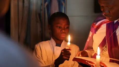 Reuters Worshipers pray during Easter prayers at a Legio Maria African Mission Church in Kibera slum in Nairobi Kenya, April 1, 2018.