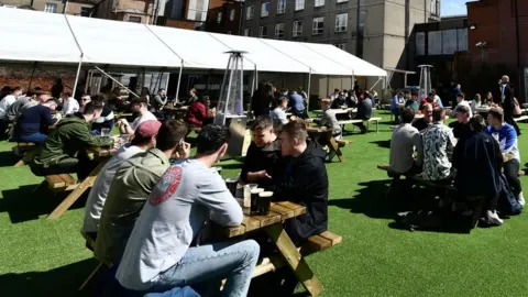 Pacemaker People drinking at an outdoor bar in Belfast