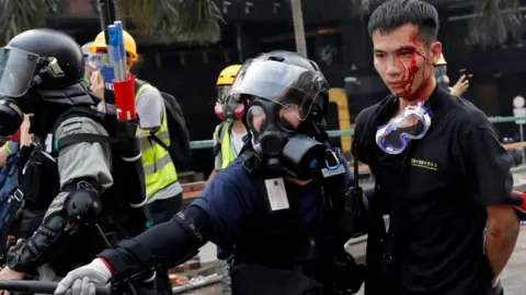Reuters A protester arrested while trying to leave the campus