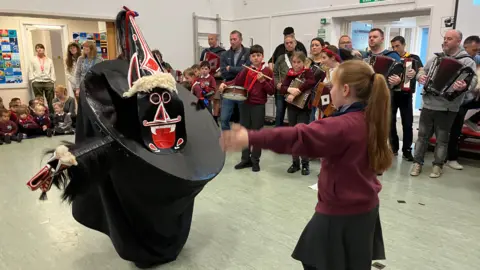 The teasing of the red 'Oss at Padstow School