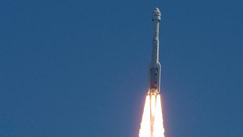 The Starliner and rocket in flight after launching into space