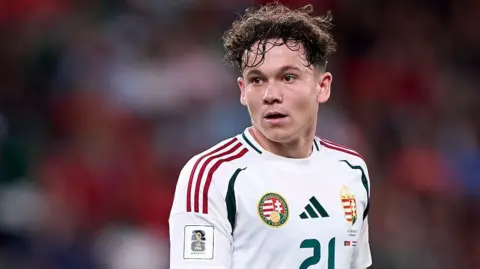 Alex Toth wearing a white Hungary national team shirt